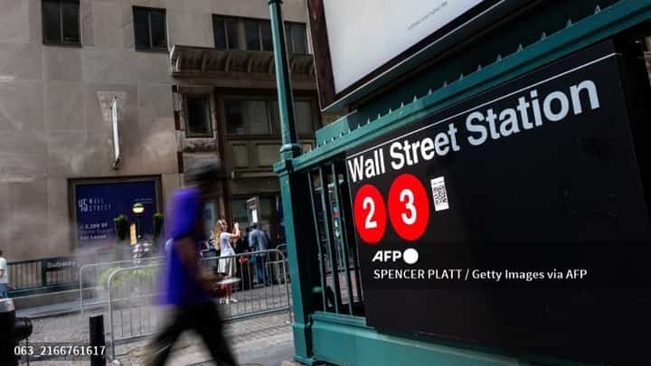 LOOK: NEW YORK, NEW YORK - 14 AUGUST: People walk through the financial district by the New York Stock Exchange (NYSE) in New York City. According to the Bureau of Labor Statistics’ latest CPI report, consumer prices rose 2.9% in July, slowing from June’s 3% annual gain.